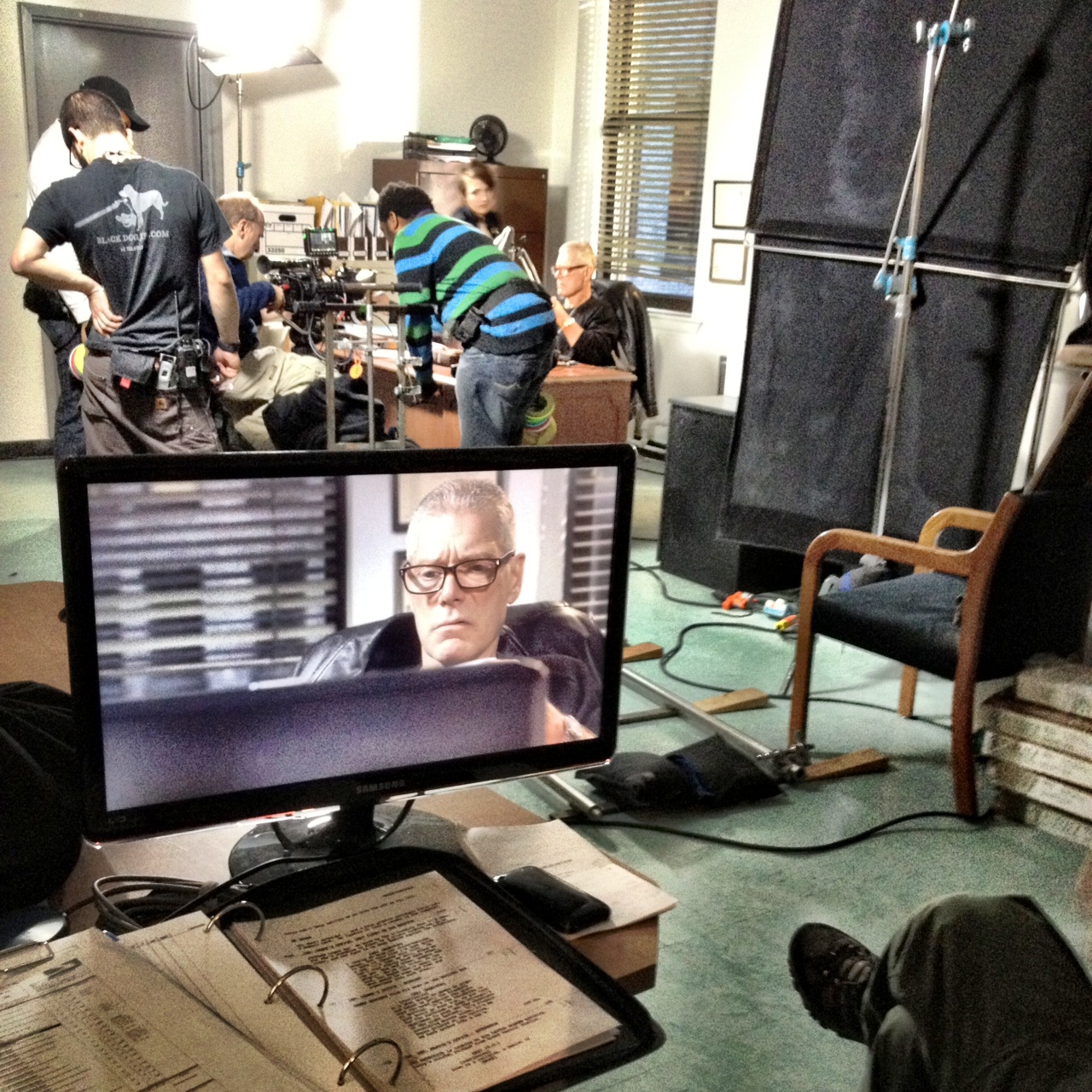 Actor Stephen Lang on the monitor (and behind the desk) on the double-duty set of "The Girl on the Train."