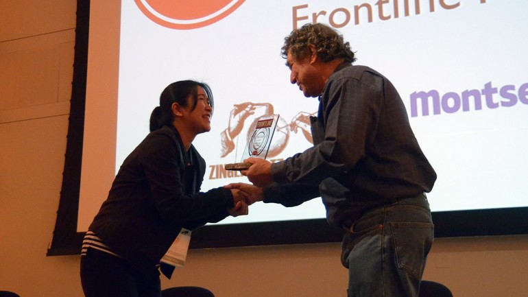 Miho Yamamoto accepting the FRONTLINE Award for Journalism in a Documentary Film at the Salem Film Fest for "The Exhibition."