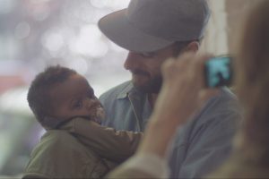 Writer/director Sebastian Silva and a baby in Nasty Baby