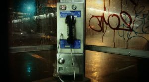 One of four outdoor phone booths left in NYC