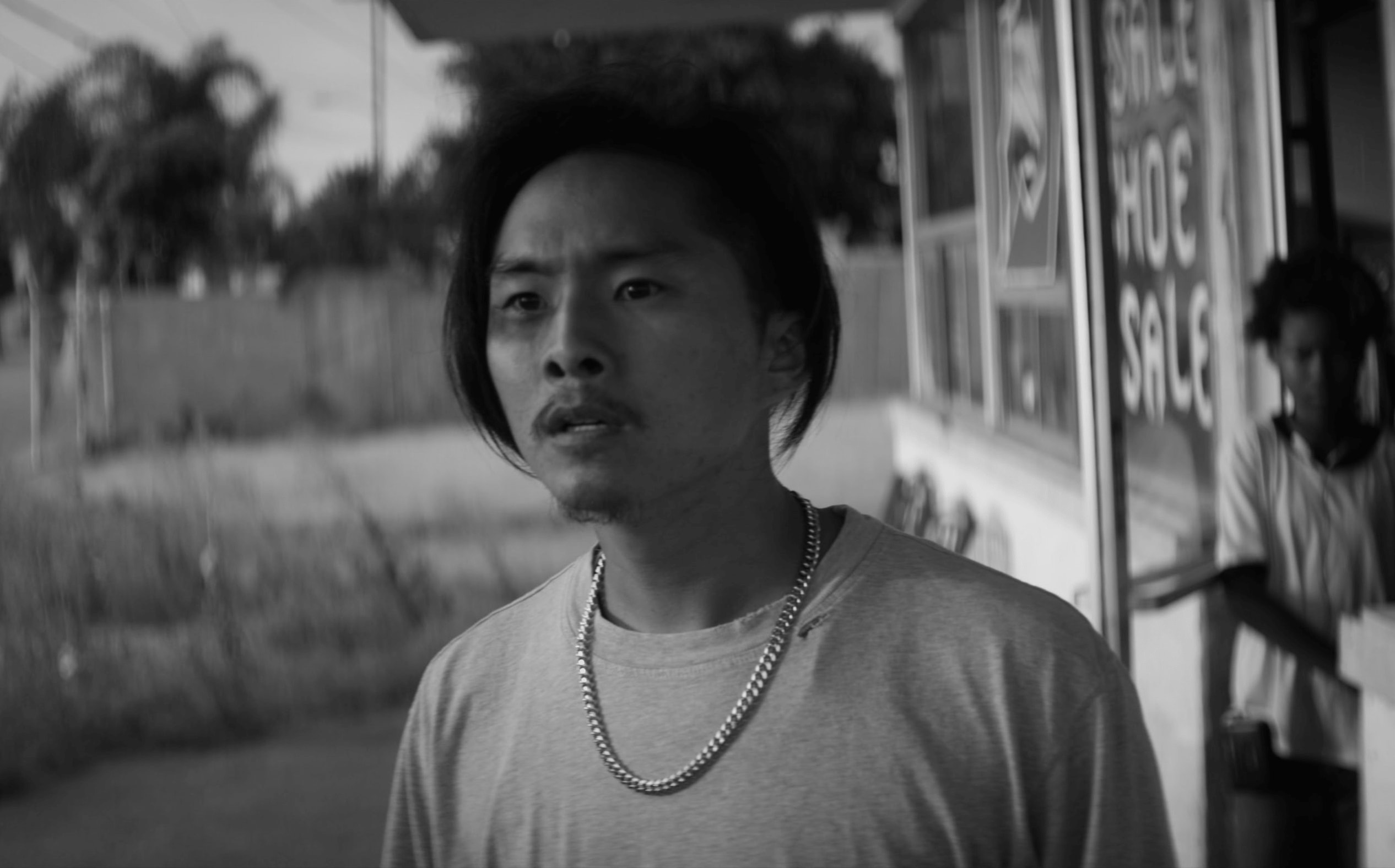 Black and white image of Justin Chon