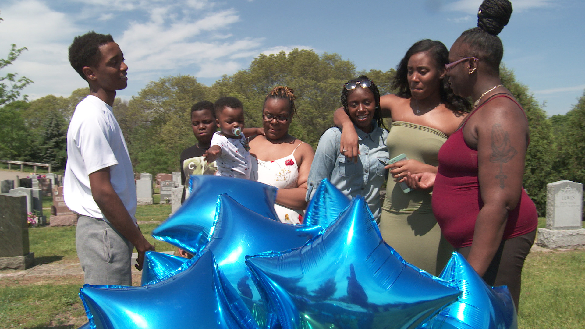 Clarissa Turner and family celebrate her son’s birthday at his graveside with blue star balloons