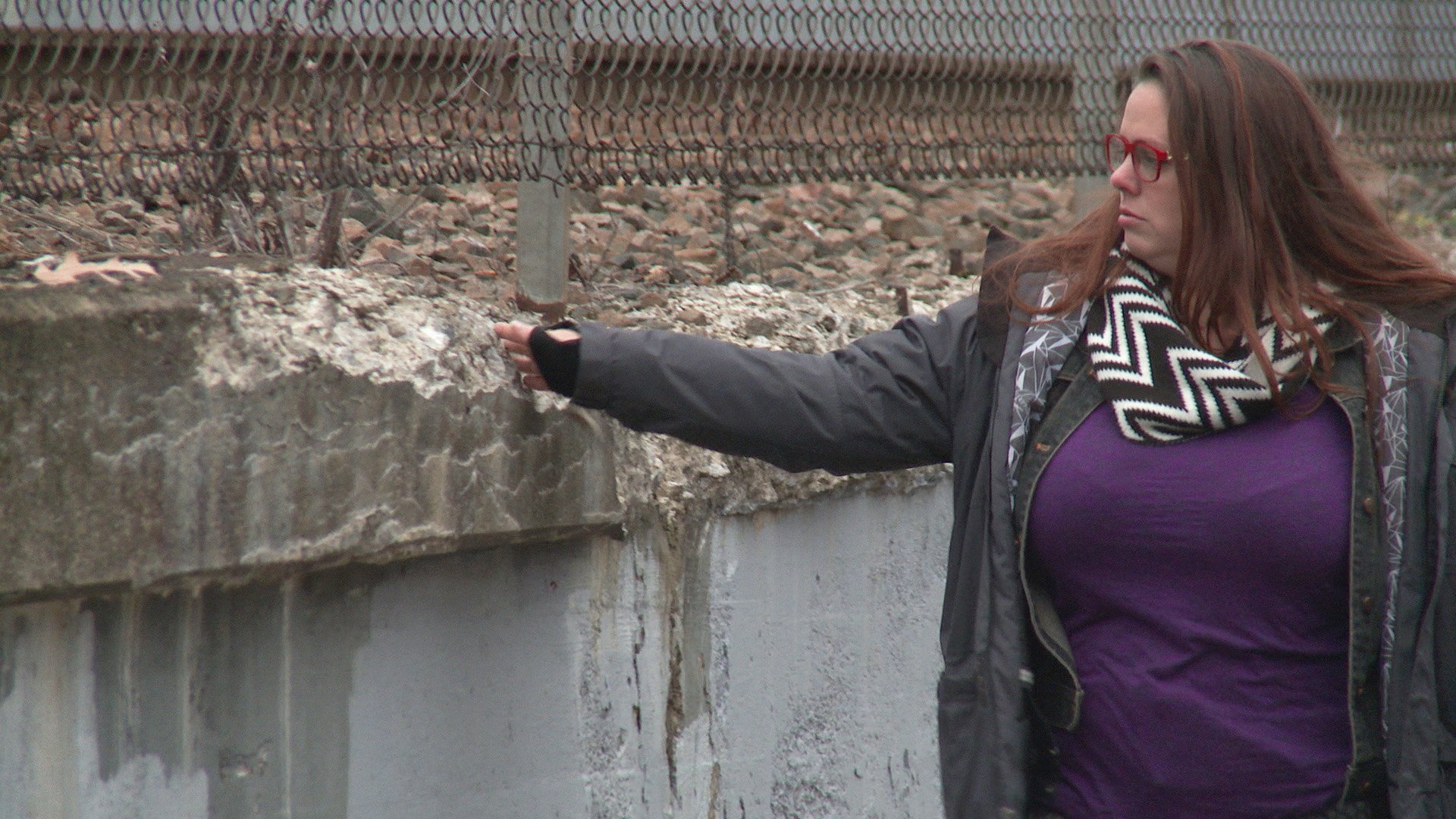 Joel’s sister Shana Turner in Boston standing next to a river.