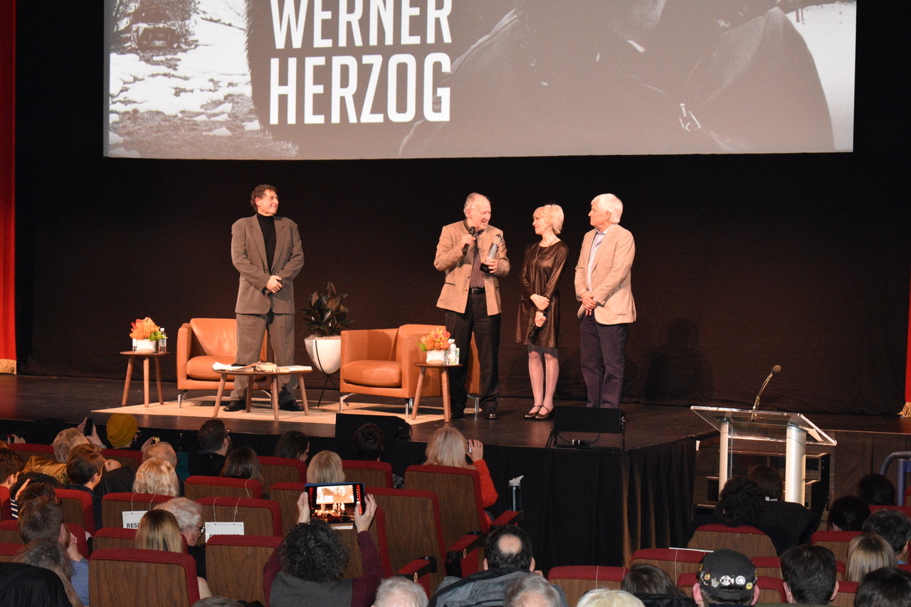 Inside Coolidge Corner Theater, Werner Herzog receiving award.