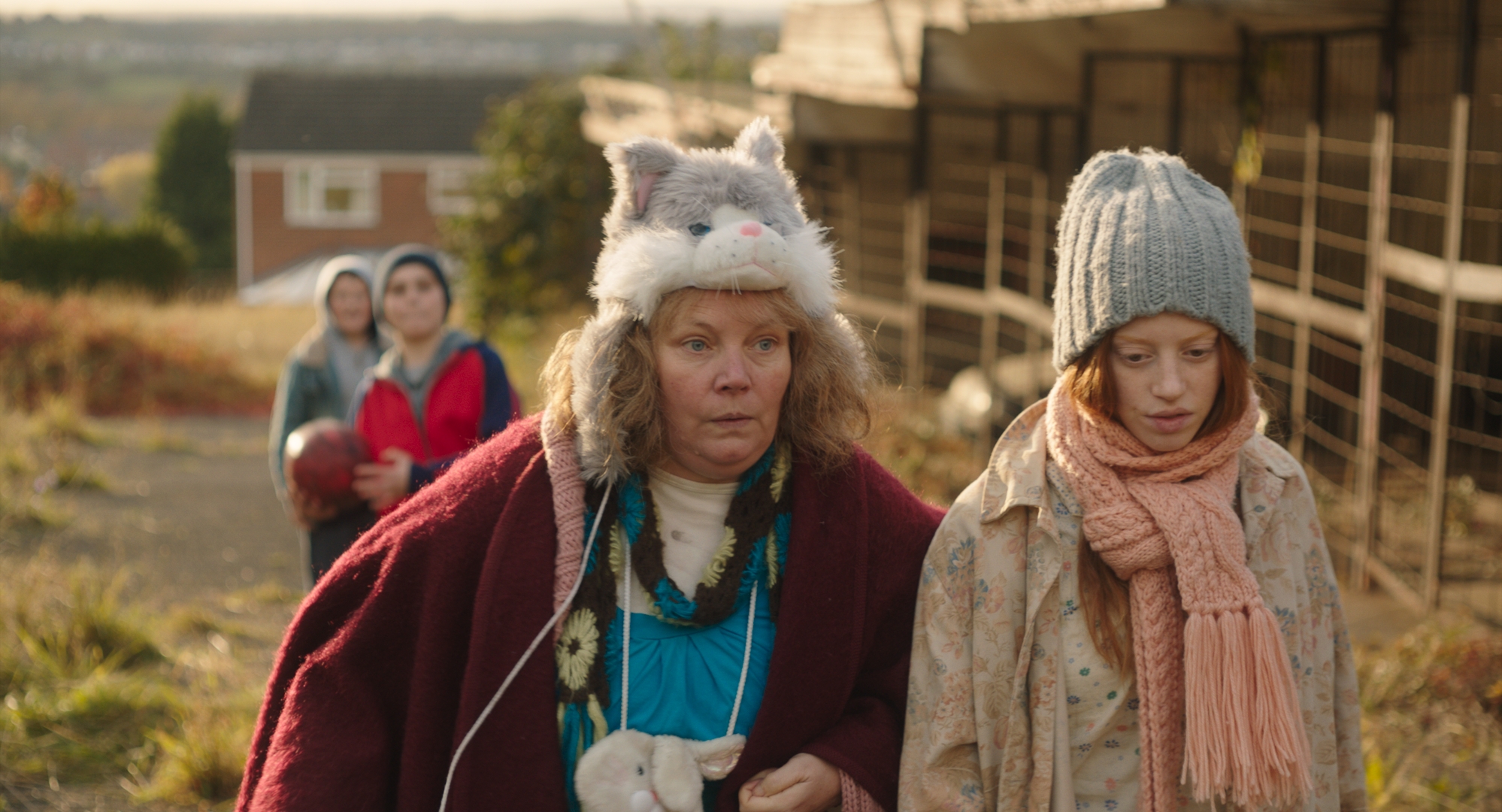 Lyn and Iona walking and wearing winter cat hats