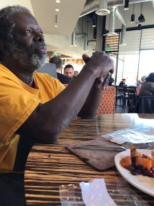 Man sitting at table.