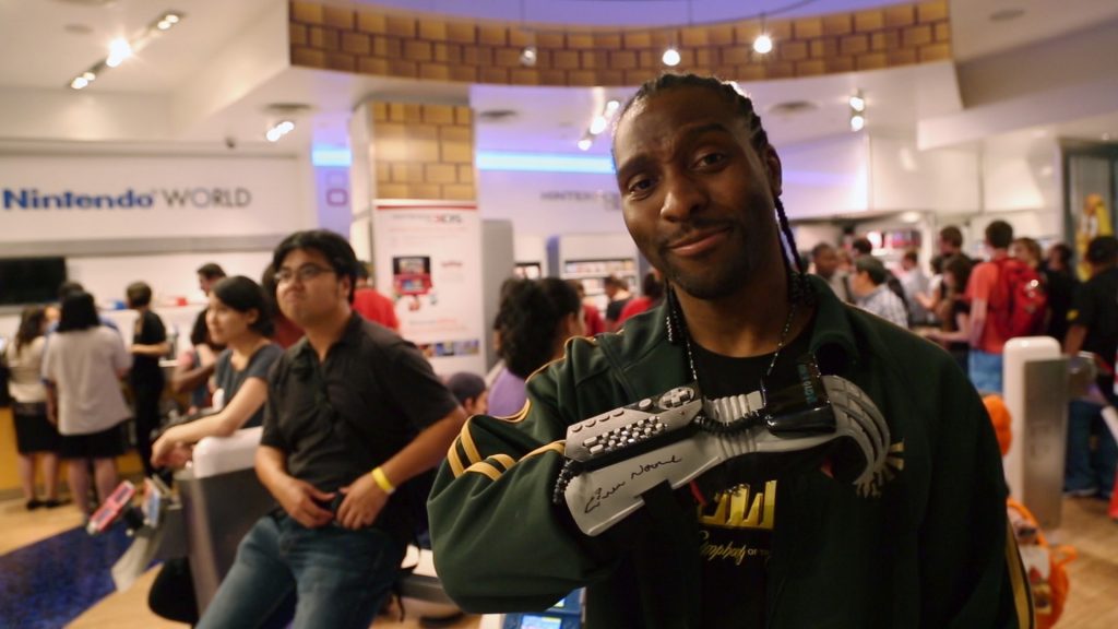 Man displays Mattel's Power Glove.