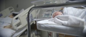 Baby in hospital bed