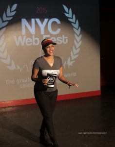 Woman greeting the crowd at the 2015 NYC Web Fest