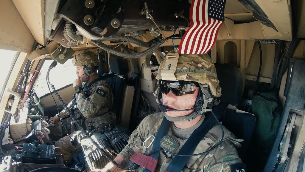 Two soldiers in vehicle