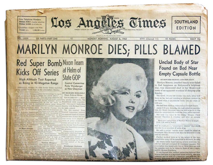 An old Los Angeles Times newspaper with the headline, "Marilyn Monroe Dies; Pills Blamed: Unclad Body of Star Found on Bed Near Empty Capsule Bottle"