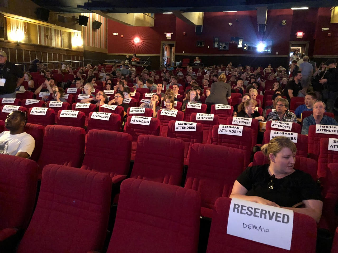 People sitting inside a movie theater.