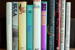 A still of 10 of Toni Morrison's novels sitting on a bookshelf side by side