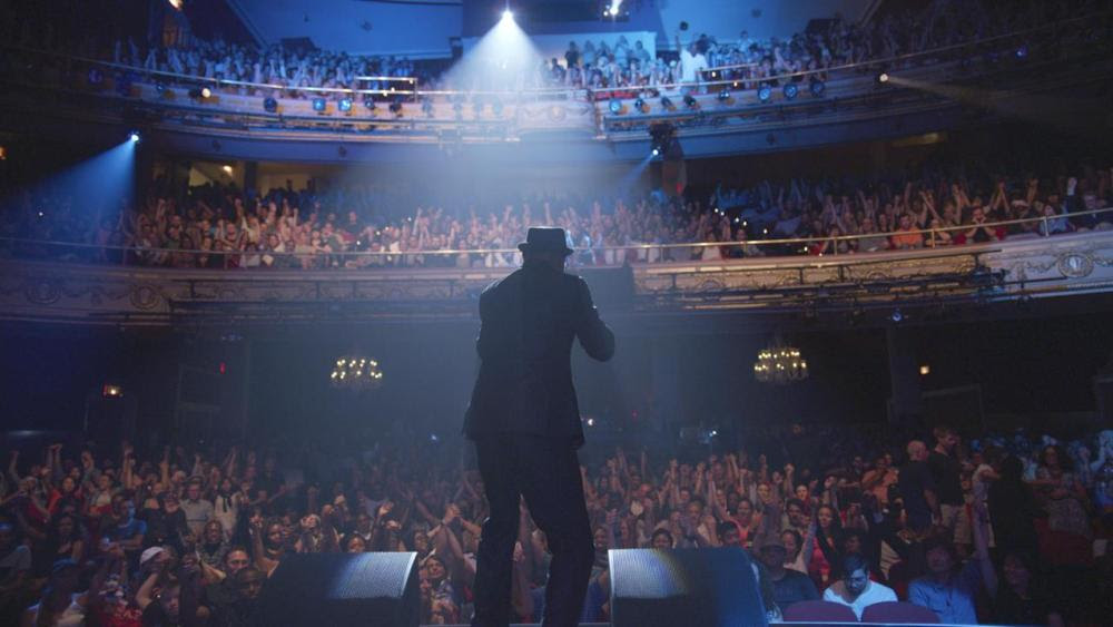 A performer under the spotlight at The Apollo Theater