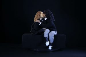 A shot of two puppets that represent the actors kissing in the film Tahara