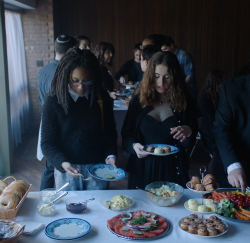 Carrie (Madeline Grey DeFreece) and Hannah (Rachel Sennott) grab some food together in the movie Tahara