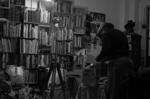 Louis Mendes at home with his extensive library