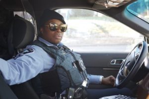 Black policewoman in car