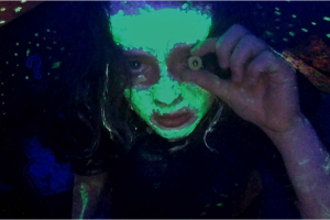 Photo of woman with glow-in-the-dark paint.