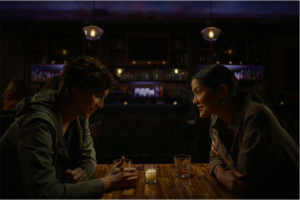 Two women sitting at a restaurant.