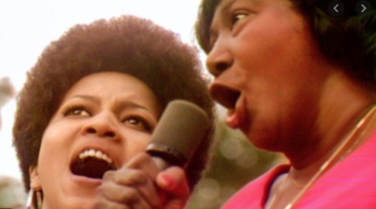 Mahalia Jackson and Mavis Staples singing together.