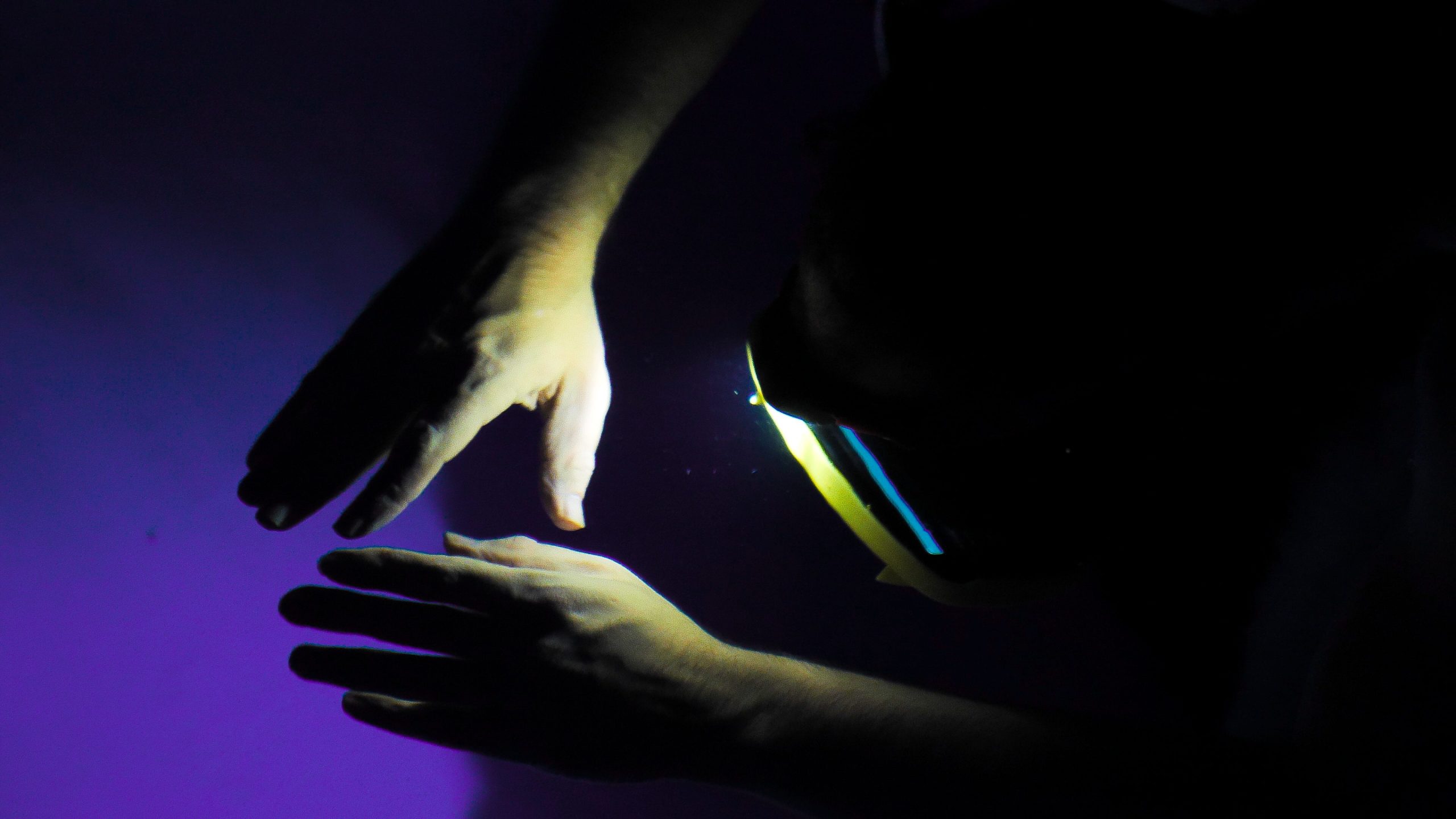 Close up of hands of viewer in SPACED OUT experience.