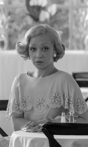 Actor Ruth Negga at a table.