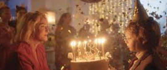 Woman and son with birthday cake