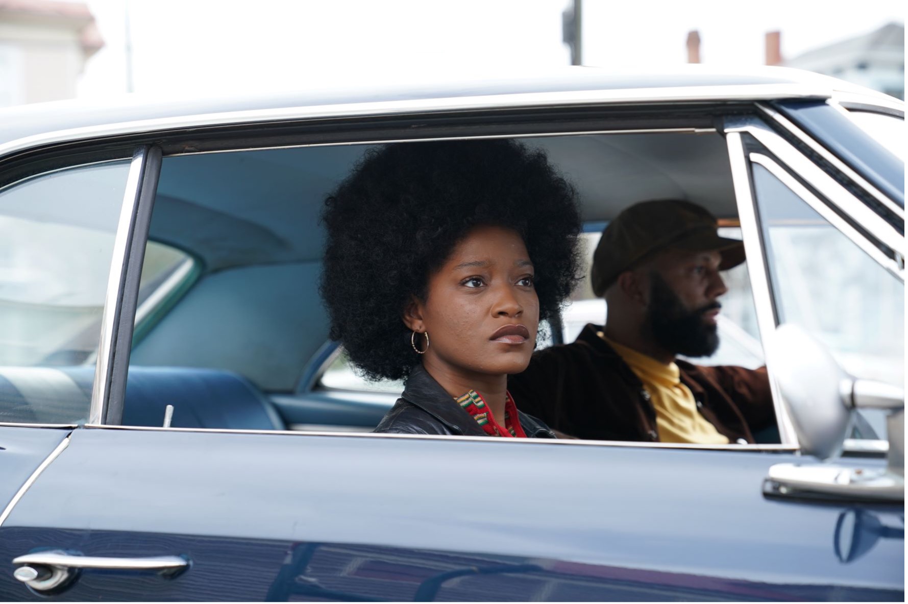Keke Palmer and Common sitting in car.