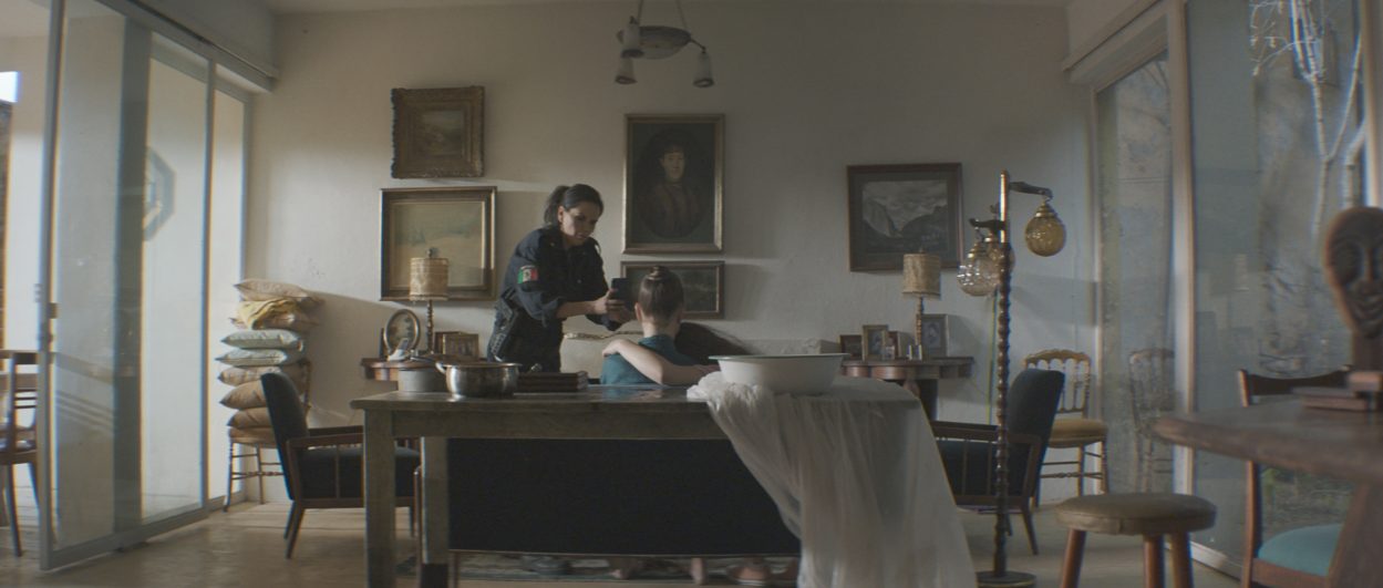 Two women in a dining room.