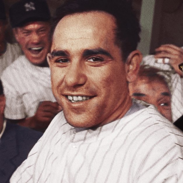 Young Yogi Berra smiles.