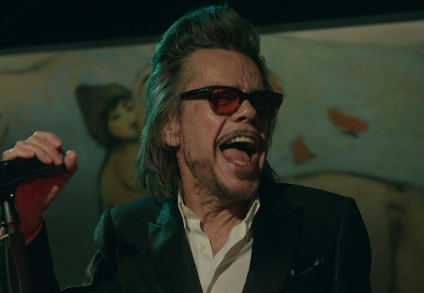 David Johansen performing on stage.