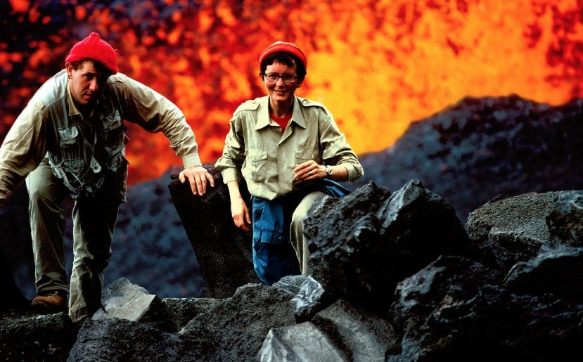 The Kraffts posing with volcanic eruption.