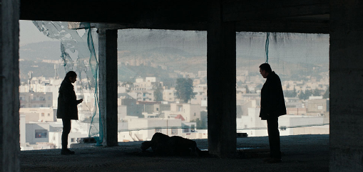 Man and Woman in front of large window.