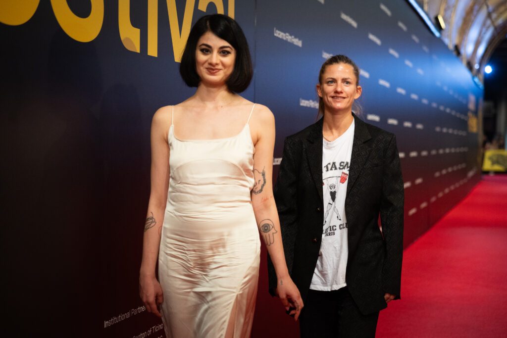 Two women walking the red carpet.