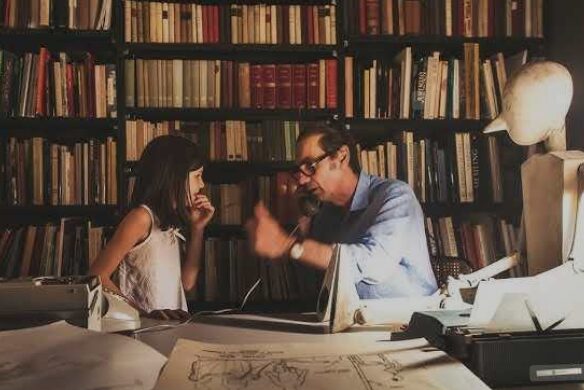 Father and daugther in library.