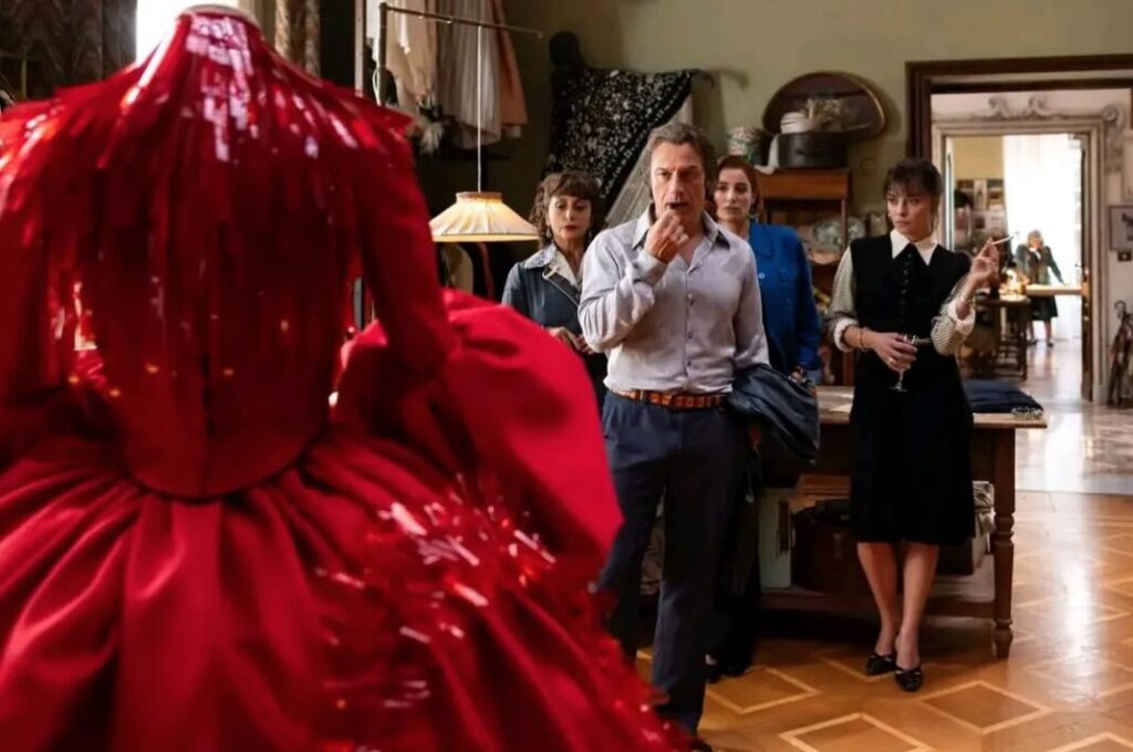 People looking at dress.