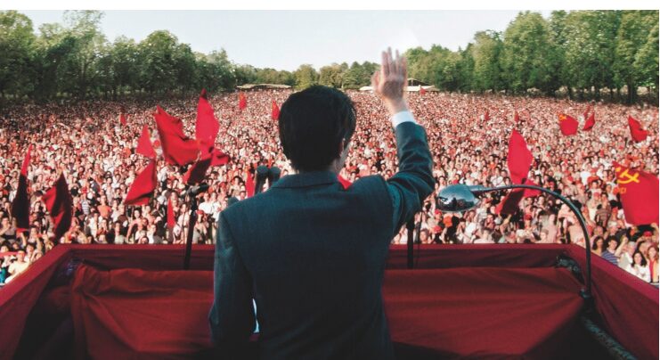 Communist leader speaking to crowd.
