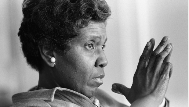 Barbara Jordan with hands claspsed.