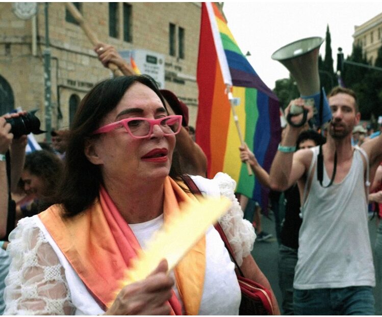 Efrat Tilma with marchers behind her.