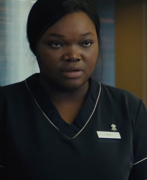 Close up of Black woman in maid outfit.