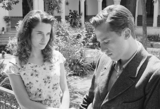 Boy and girl in garden.