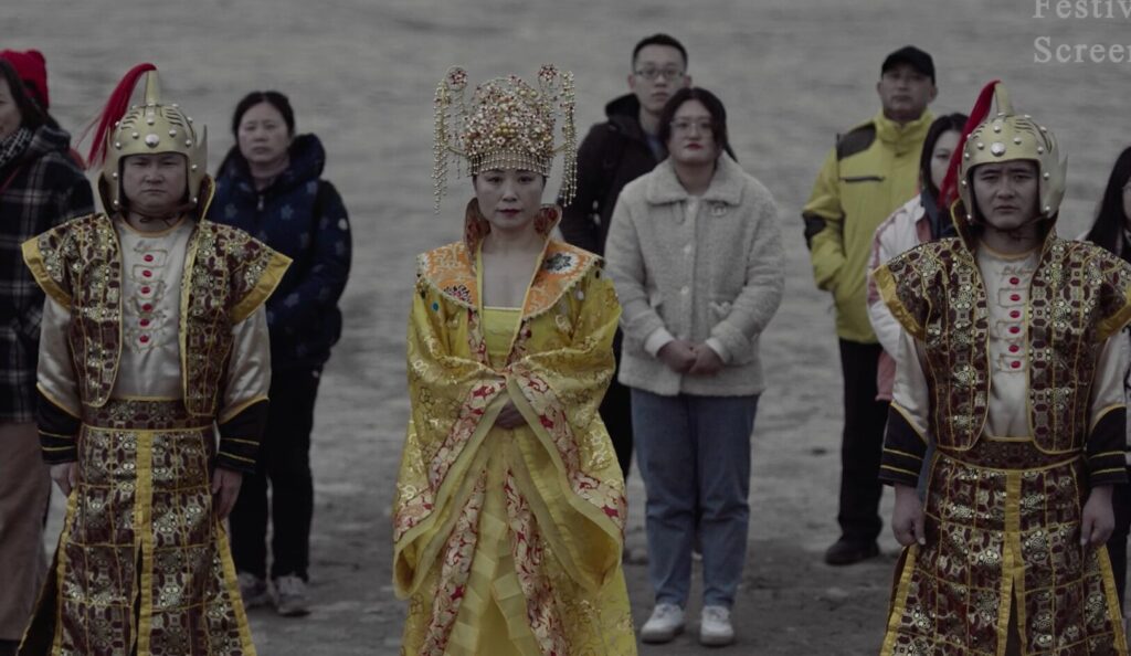 Three dancers in colorful outfits.