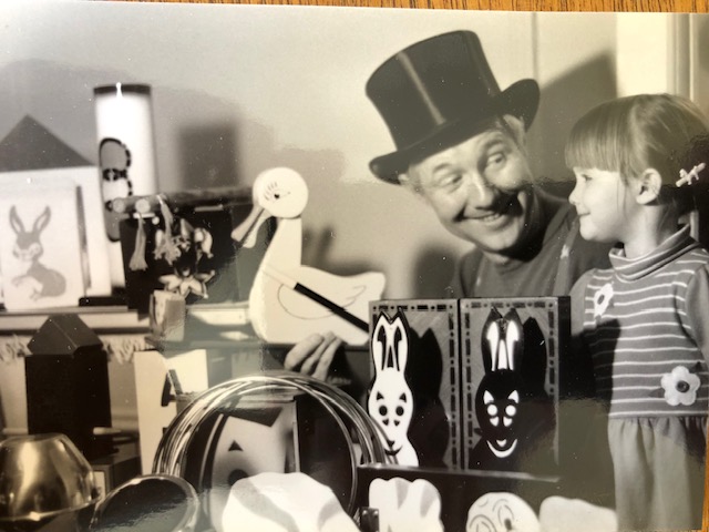 Magician and child.