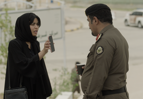 Saudi woman shows phone to officer