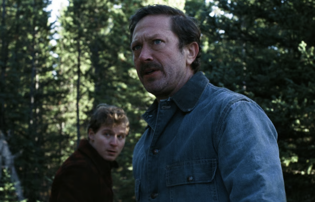 Father and son in the woods.